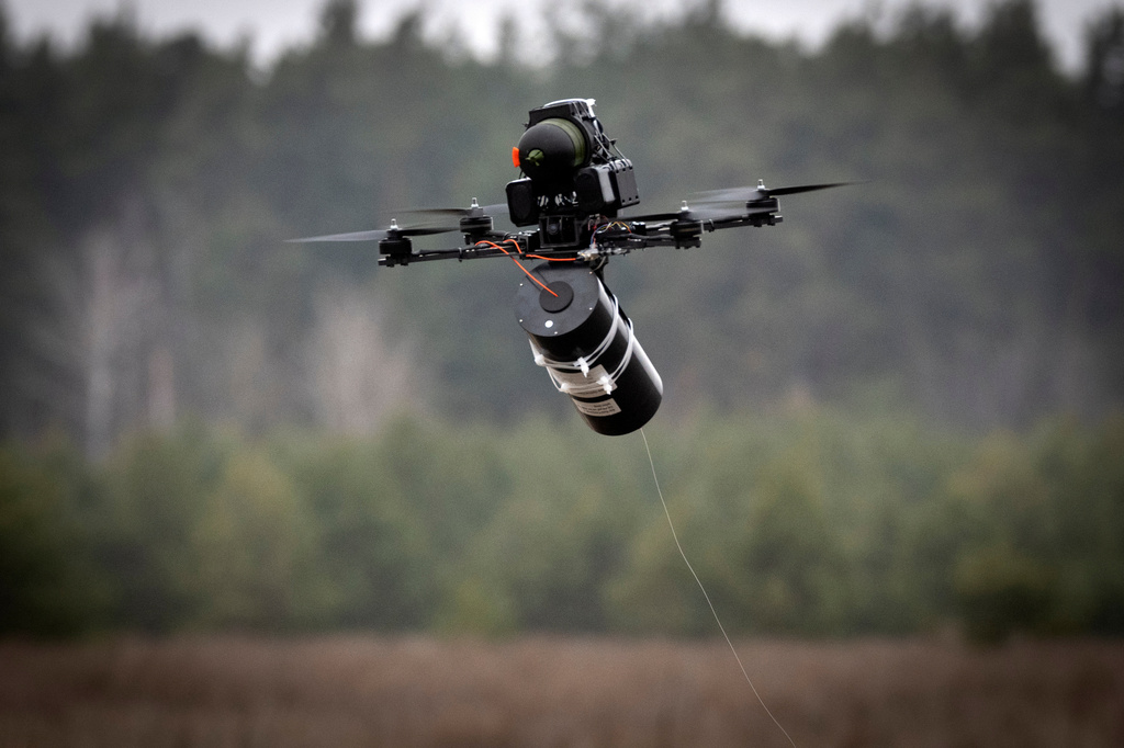 FILE - A Ukrainian made FPV fibre optic drone flies at a military market place at an undisclosed location in the Kyiv region, Ukraine, Jan. 29, 2025. (AP Photo/Efrem Lukatsky, File)