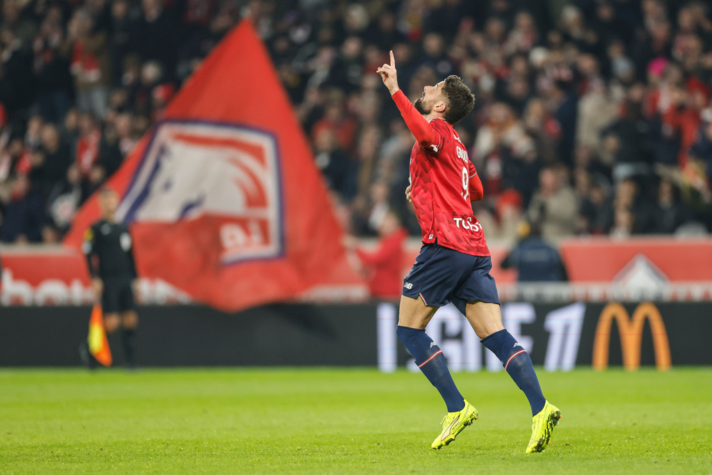 Lille's Olivier Giroud celebrates after scoring his side's first goal during the French League One soccer match between Lille and Paris FC in Lille, France, Sunday Nov. 23, 2025. (AP Photo/Jean-Francois Badias)