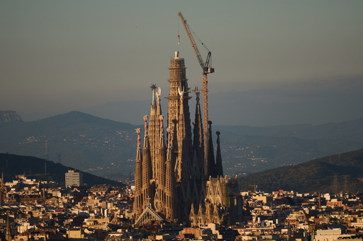 View of the Sagrada Familia basilica, which became the world's tallest church on Thursday after a section of its central tower was lifted into place, in Barcelona, Spain, Oct. 30, 2025. (AP Photo/Emilio Morenatti) View of the Sagrada Familia basilica, which became the world's tallest church on Thursday after a section of its central tower was lifted into place, in Barcelona, Spain, Oct. 30, 2025. (AP Photo/Emilio Morenatti)
