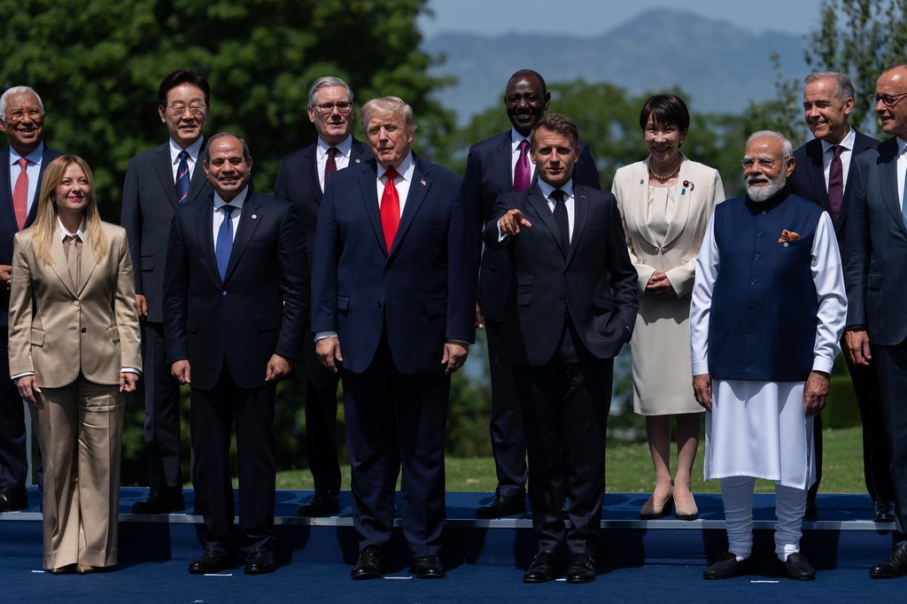 FILE - Italian Prime Minister Giorgia Meloni (front, left) gathers with other world leaders for a group photo at the G7 summit, Tuesday, June 16, 2026, in Evian-les-Bains, France. (AP Photo/Julia Demaree Nikhinson, File)
