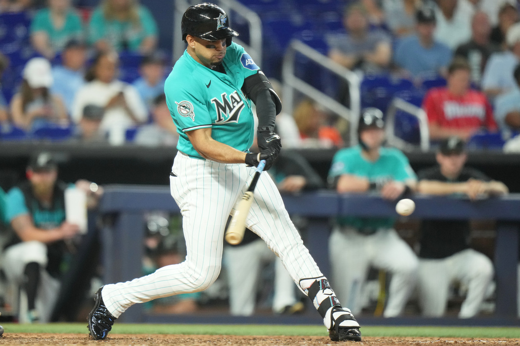 Miami Marlins' Christopher Morel hits a single during the ninth inning of a baseball game against the New York Mets, Sunday, May 24, 2026, in Miami. (AP Photo/Lynne Sladky)