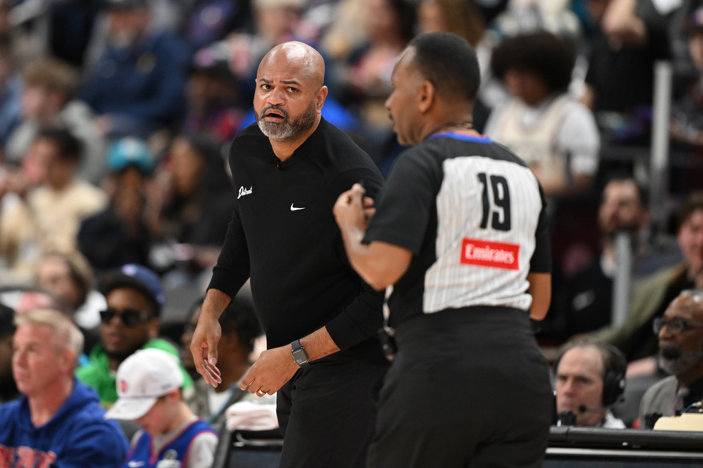Detroit Pistons head coach J.B. Bickerstaff, left, talks with referee James Capers (19) in the first half of an NBA basketball game against the Minnesota Timberwolves, Thursday, April 2, 2026, in Detroit. (AP Photo/Lon Horwedel)