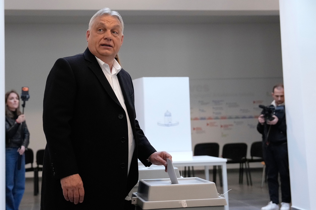 Hungary's Prime Minister Viktor Orban casts his vote in Budapest, Hungary, Sunday, April 12, 2026. (AP Photo/Petr David Josek)