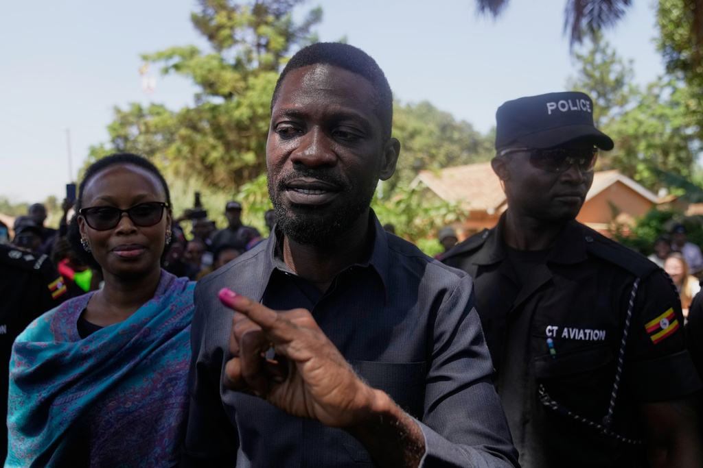 Uganda opposition presidential candidate Robert Kyagulanyi Ssentamu, famously known as Bobi Wine of the National Unity Platform (NUP), shows the ink on his finger after casting his vote, during the presidential election at a polling station, in Kampala, Uganda, Thursday, Jan. 15, 2026. (AP Photo/Brian Inganga)