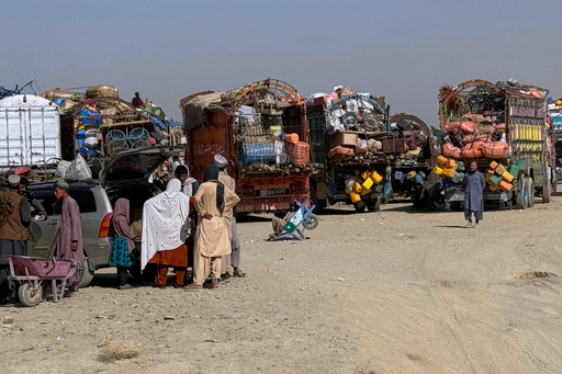 Afghan refugees gather beside trucks loaded with their belongings as they wait their turn to leave for their homeland through a border crossing point which partially opens following Oct.19 ceasefire, on the outskirts of Chaman, a border town on the Pakistan Afghan border, Wednesday, Oct. 29, 2025. (AP Photo/H. Achakzai) Afghan refugees gather beside trucks loaded with their belongings as they wait their turn to leave for their homeland through a border crossing point which partially opens following Oct.19 ceasefire, on the outskirts of Chaman, a border town on the Pakistan Afghan border, Wednesday, Oct. 29, 2025. (AP Photo/H. Achakzai)