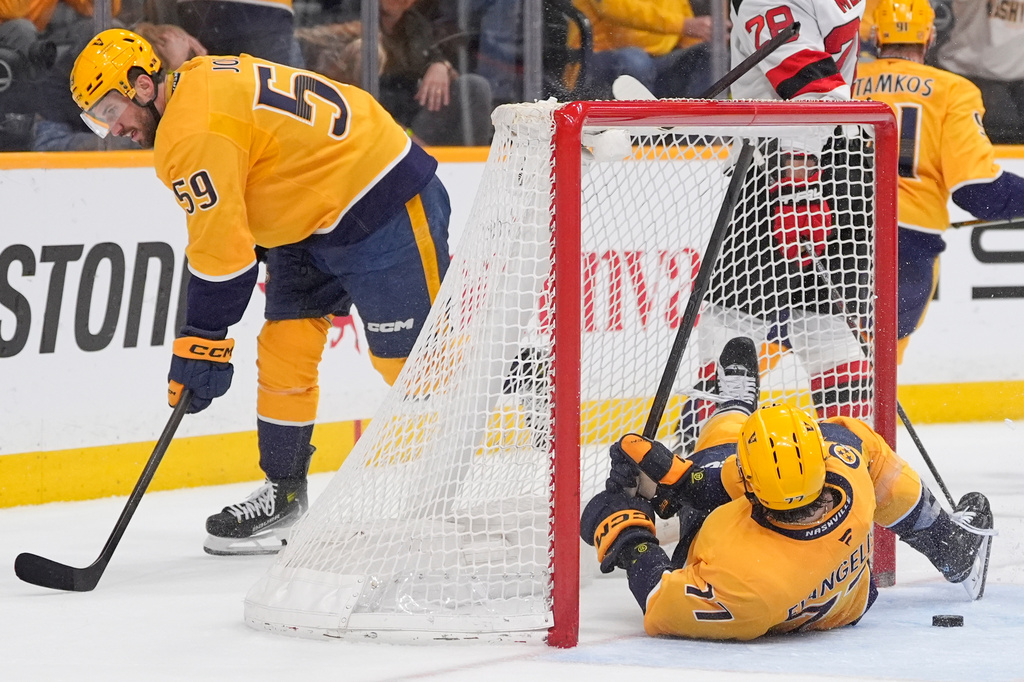 Nashville Predators right wing Luke Evangelista (77) breaks his stick after the team's loss in an NHL hockey game against the New Jersey Devils, Thursday, March 26, 2026, in Nashville, Tenn. (AP Photo/George Walker IV)