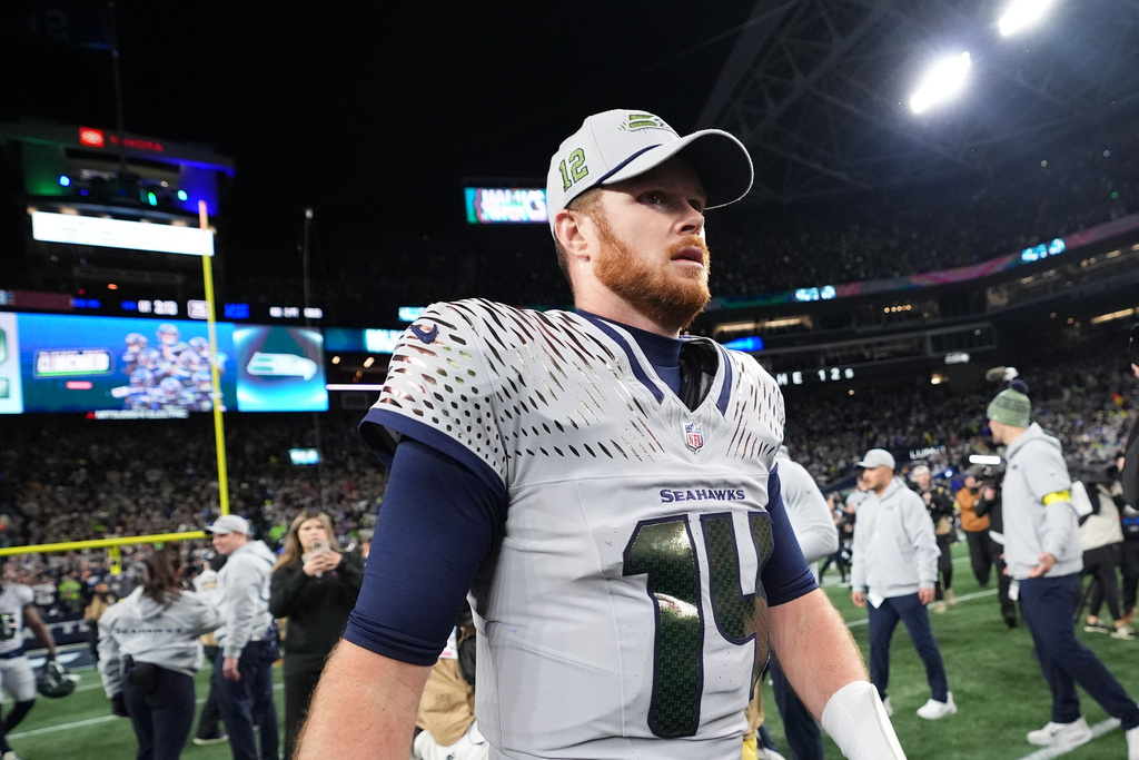 Seattle Seahawks quarterback Sam Darnold (14) walks on the field after an NFL football game against the Los Angeles Rams, Thursday, Dec. 18, 2025, in Seattle. (AP Photo/Lindsey Wasson)