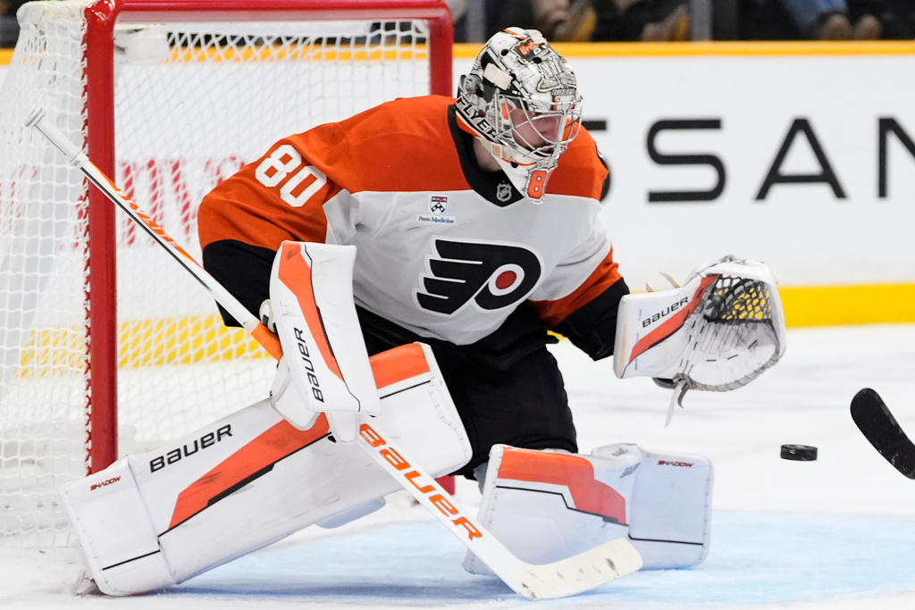 Philadelphia Flyers goaltender Dan Vladar (80) deflects a shot on goal during the second period of an NHL hockey game against the Nashville Predators, Thursday, Nov. 6, 2025, in Nashville, Tenn. (AP Photo/George Walker IV)