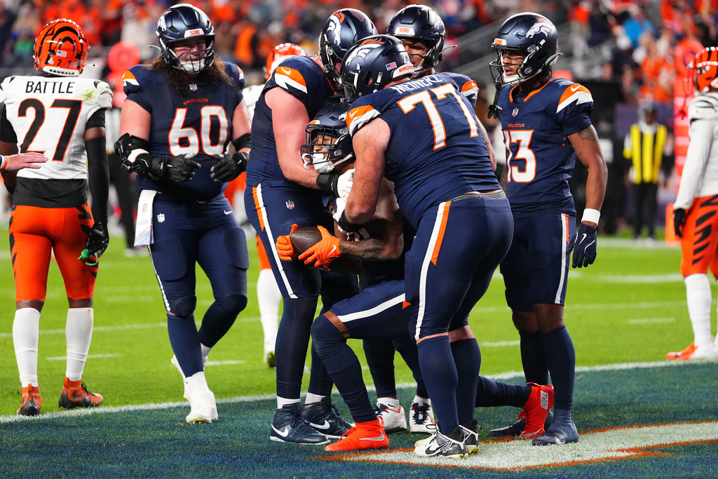 Denver Broncos wide receiver Courtland Sutton (14) celebrates with teammates after scoring a touchdown against the Cincinnati Bengals during the first half of an NFL football game Monday, Sept. 29, 2025, in Denver. (AP Photo/Jack Dempsey)