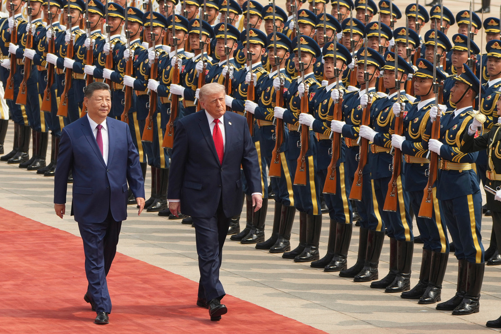 FILE - President Donald Trump, right, participates in a welcome ceremony with China's President Xi Jinping at the Great Hall of the People, May 14, 2026, in Beijing. (AP Photo/Mark Schiefelbein, File)