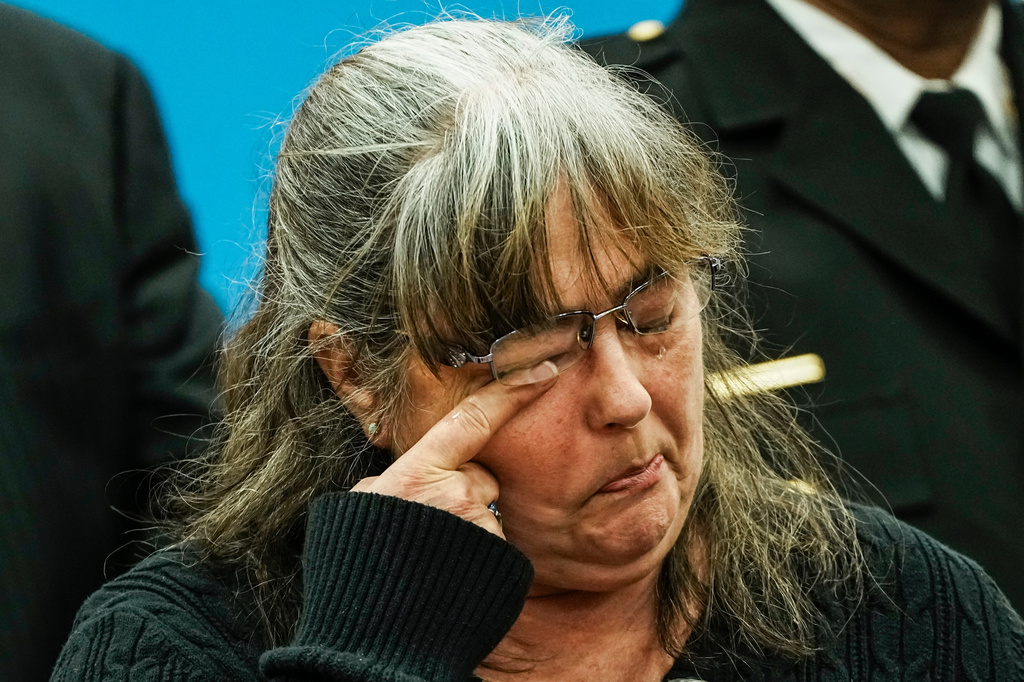 A family member of the victims cries as she listens Suffolk County District Attorney Raymond A. Tierney during a news conference after Rex Heuermann, accused in Long Island's infamous Gilgo Beach serial killings, pleaded guilty on Wednesday, April 8, 2026, at Suffolk County Police Academy Gymnasium in Brentwood, New York. (AP Photo/Eduardo Munoz Alvarez)