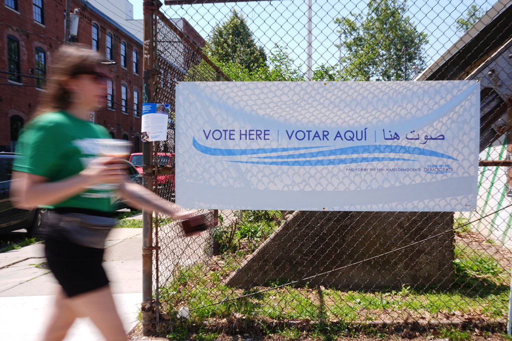 A person walks outside a polling place in Philadelphia, Tuesday, May 19, 2026. (AP Photo/Matt Rourke)