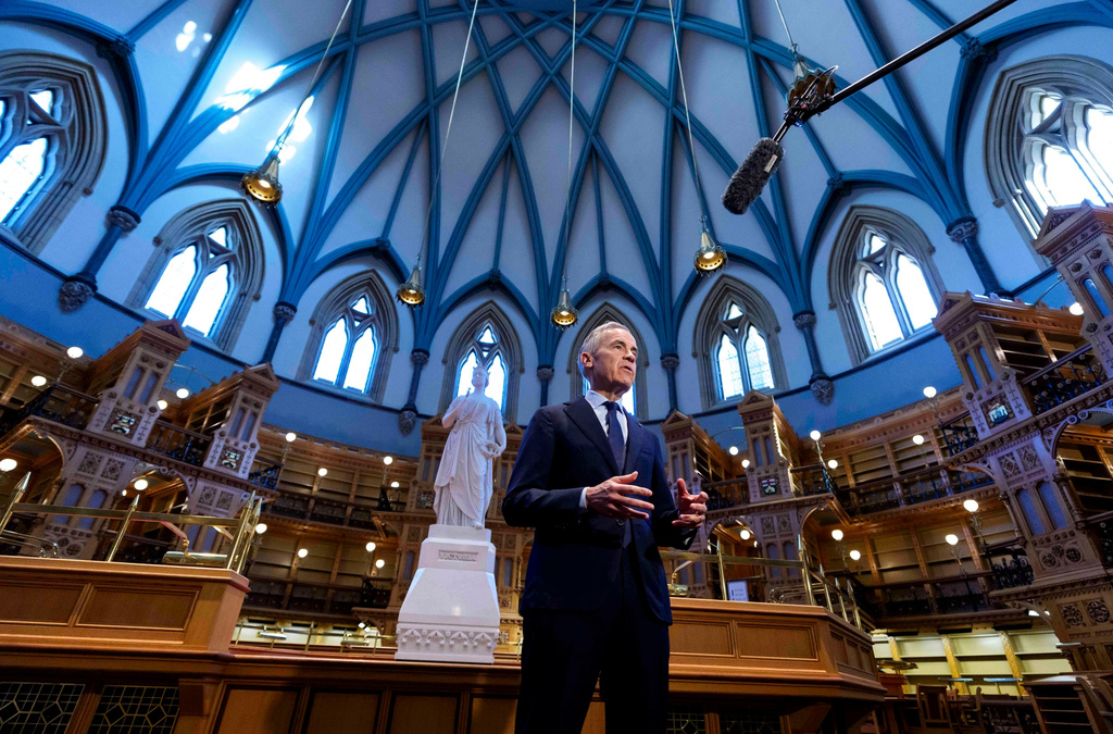 Prime Minister Mark Carney makes a statement in the Library of Parliament in Centre Block on Parliament Hill, in Ottawa, on Friday, May 22, 2026. (Justin Tang/The Canadian Press via AP)
