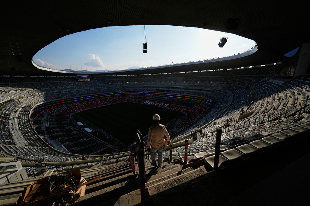 Workers renovate the Azteca Stadium during a press tour ahead of the 2026 World Cup, in Mexico City, Thursday, March 26, 2026. (AP Photo/Marco Ugarte)