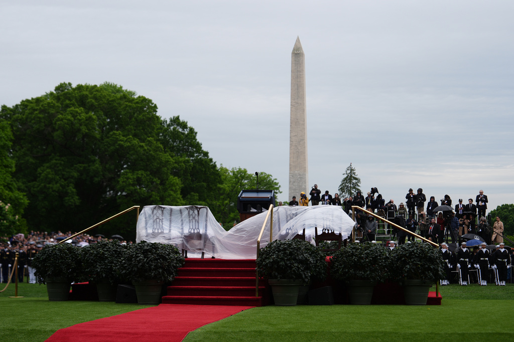 Chairs are covered to protect them from the rain ahead of a State Visit arrival ceremony on the South Lawn of the White House, Tuesday, April 28, 2026, in Washington. (AP Photo/Julia Demaree Nikhinson)