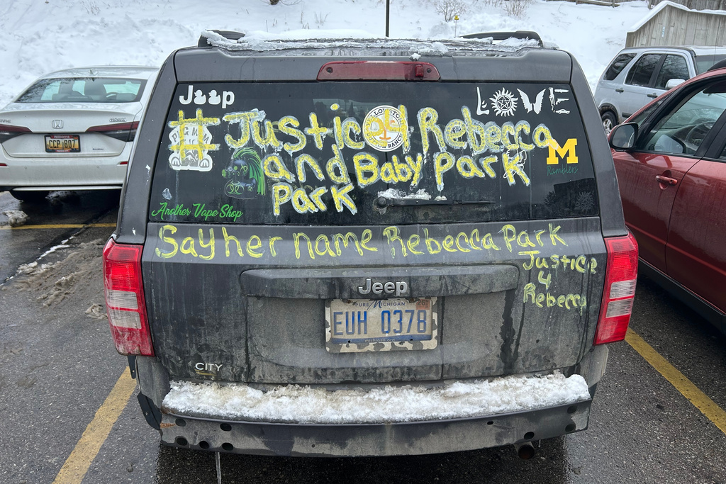 Messages of support for Rebecca Park and her child are written on a vehicle parked at district court prior to the arraignment for Cortney and Bradley Bartholomew Tuesday, Dec. 2, 2025, in Wexford County, Mich. (Gus Burns/The Grand Rapids Press via AP)