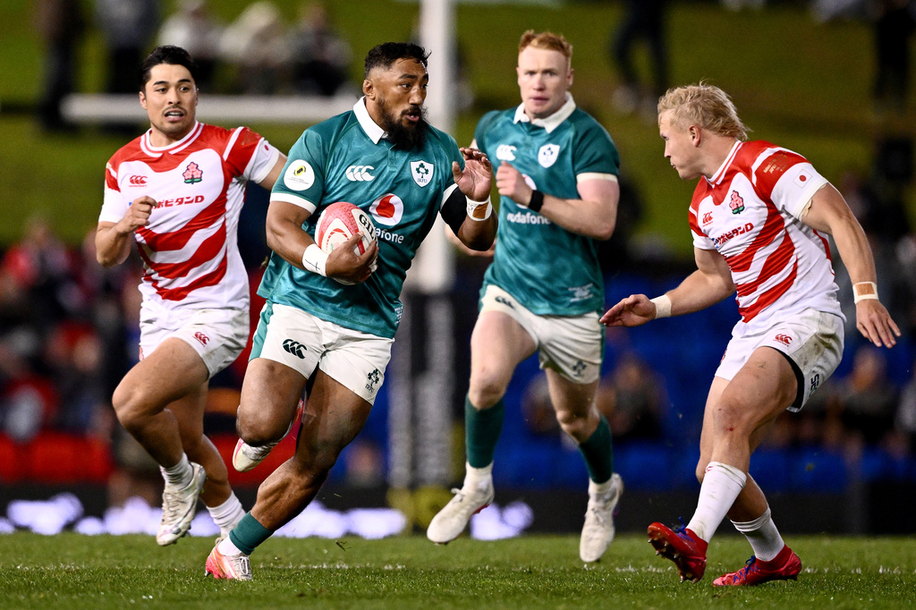 Bundee Aki of Ireland runs at Japan's Sam Greene during the Nations Championship rugby international between Japan and Ireland in Newcastle, Australia, Saturday, July 11, 2026. (Dan Himbrechts/AAPImage via AP)