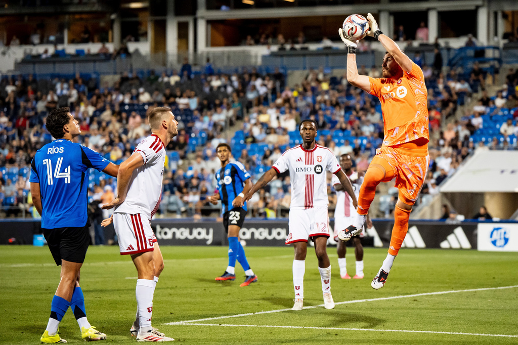 Toronto FC goalkeeper Luka Gavran (1) makes a save during second half of an MLS soccer game against CF Montreal, in Montreal on Thursday, July 16, 2026. (Christopher Katsarov/The Canadian Press via AP)
