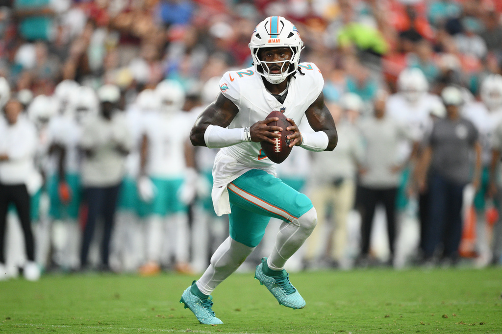 Miami Dolphins quarterback Malik Willis (2) aims a pass during the first half of an NFL preseason football game against the Washington Commanders, Friday, Aug. 14, 2026, in Landover, MD. (AP Photo/Nick Wass)