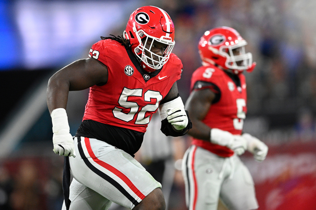 FILE - Georgia defensive lineman Christen Miller (52) heads to the sideline after a play against Florida during the second half of an NCAA college football game Saturday, Nov. 2, 2024, in Jacksonville, Fla. (AP Photo/Phelan M. Ebenhack, File)