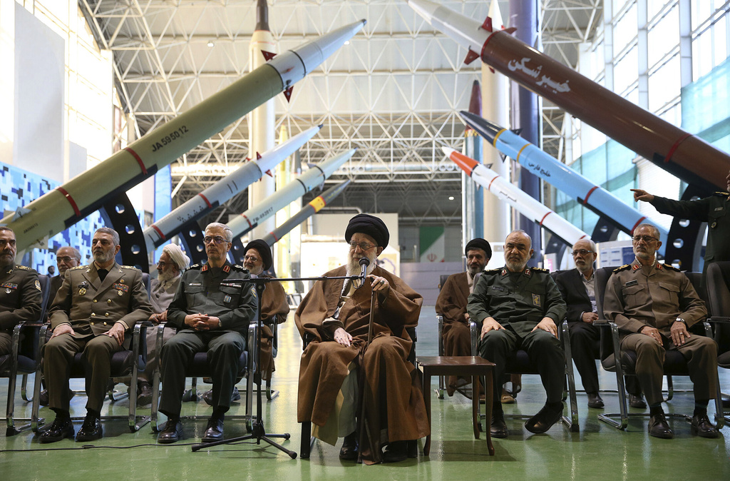 FILE - In this photo released by an official website of the office of the Iranian supreme leader, Supreme Leader Ayatollah Ali Khamenei, center, accompanied by the armed forces commanders, visits an exhibition of the Revolutionary Guard's aerospace achievements, in Iran, Nov. 19, 2023. (Office of the Iranian Supreme Leader via AP, File)