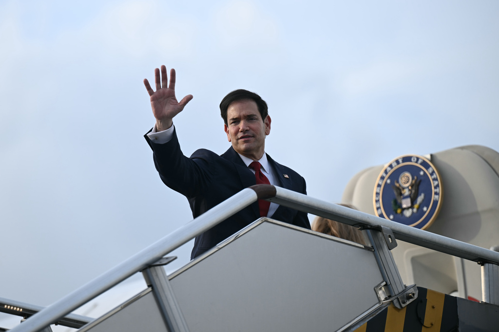 Secretary of State Marco Rubio waves from the top of the steps to his plane to depart at Ninoy Aquino International Airport in Manila, Philippines, following his visit to attend the Association of Southeast Asian Nations (ASEAN) Foreign Ministers Meeting,Thursday, July 23, 2026. (Brendan Smialowski/Pool Photo via AP)