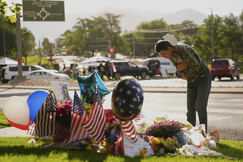 Wendy Lucas, Utah Valley University student looks at a memorial set up for Charlie Kirk at Utah Valley University in Orem, Utah, Friday, Sept. 12, 2025. (AP Photo/Lindsey Wasson)