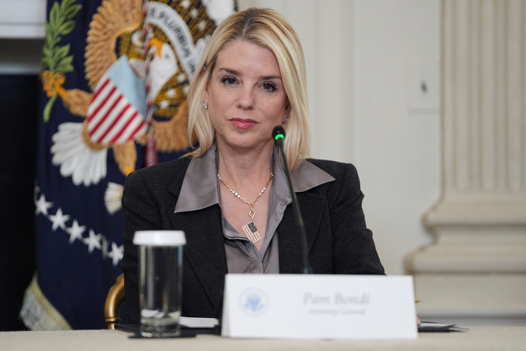 Attorney General Pam Bondi listens as President Donald Trump speaks during a roundtable on criminal cartels in the State Dining Room of the White House, Thursday, Oct. 23, 2025, in Washington. (AP Photo/Evan Vucci)