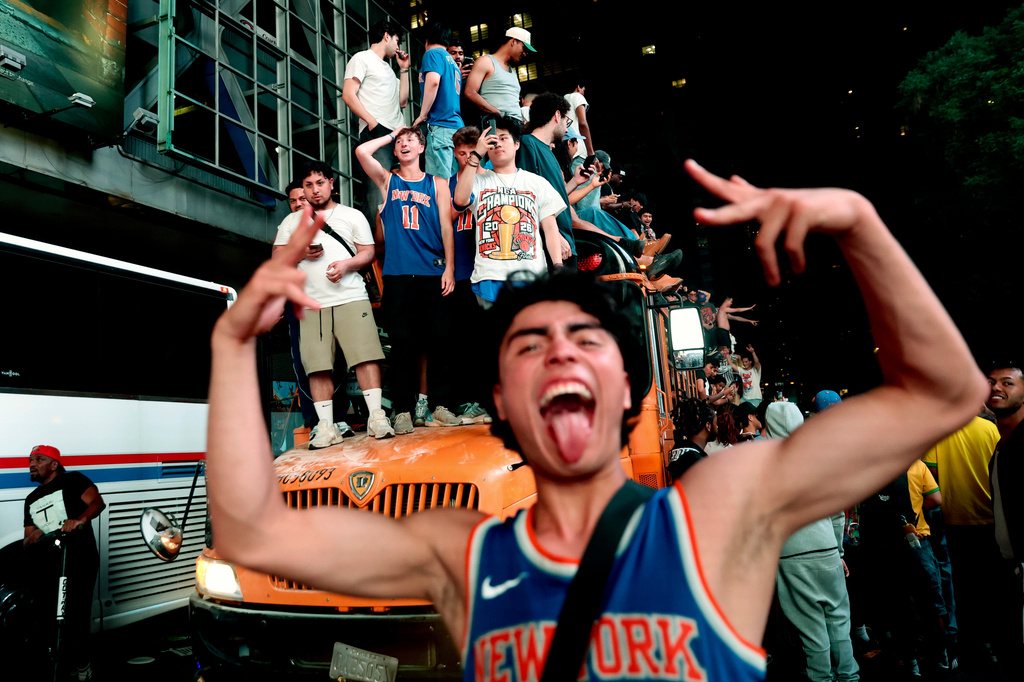 New York Knicks fans celebrate their victory after Game 5 of the NBA Finals basketball series against the San Antonio Spurs, Saturday, June 13, 2026, in New York. (AP Photo/Heather Khalifa)