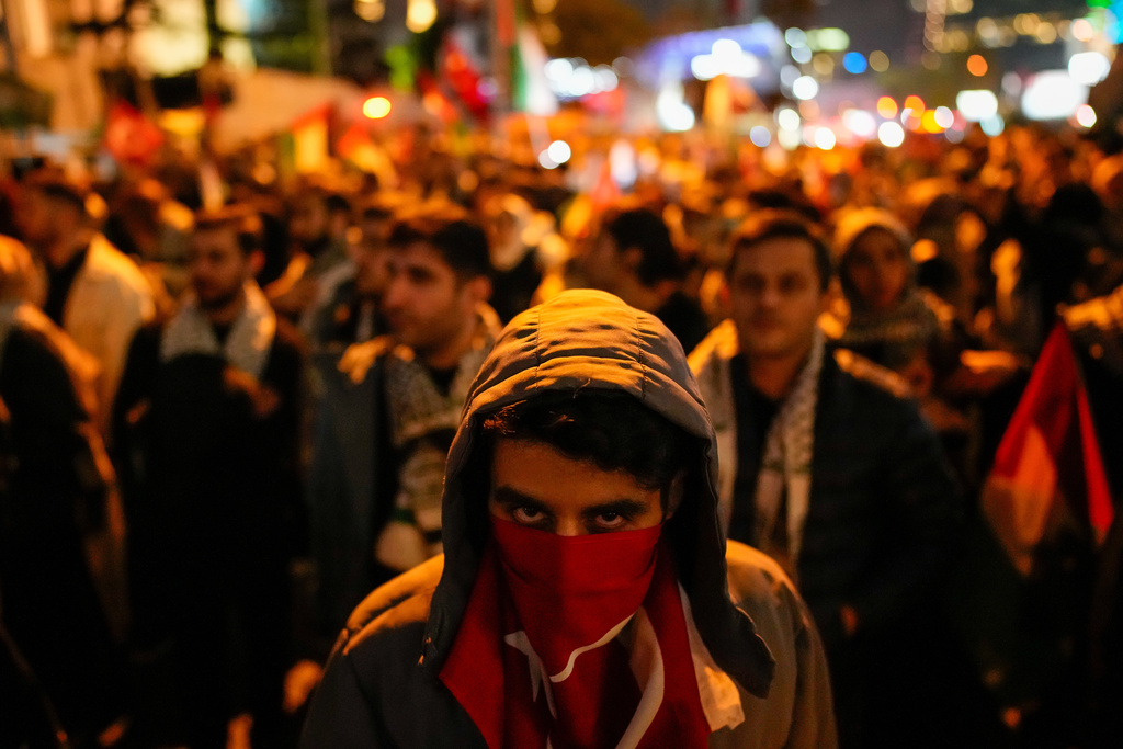 People gather in front of the Israel consulate during a protest against the interception of the Gaza-bound Sumud flotilla by Israeli navy forces, in Istanbul, Thursday, Oct. 2, 2025. (AP Photo/Emrah Gurel)