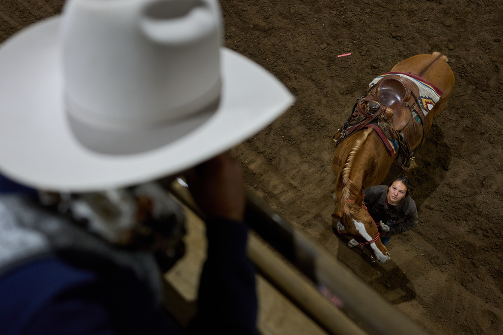 Jessee Vigen, right, speaks with Joe Reum, a professor of equine studies, during a class in the Nueta Hidatsa Sahnish College equine studies program at the Healing Horse Ranch, Wednesday, Oct. 29, 2025, in Parshall, N.D. (AP Photo/John Locher)
