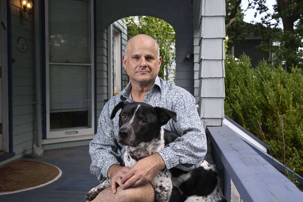 Dean Karlan, former USAID chief economist, poses at his home, Friday, Sept. 19, 2025, in Evanston, Ill. (AP Photo/Matt Marton)