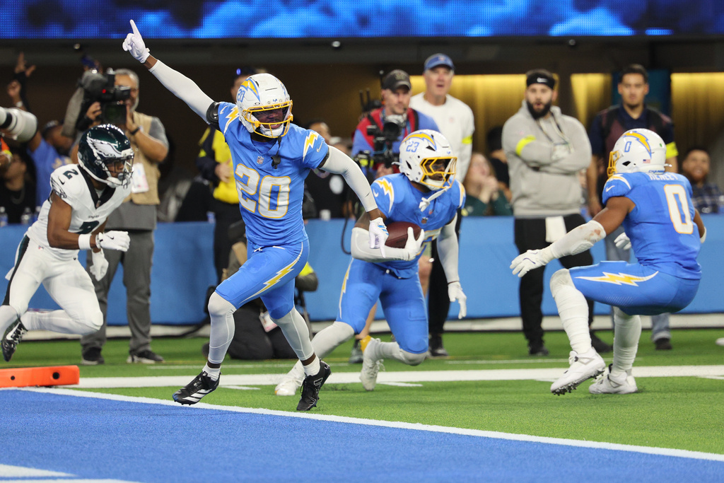 Los Angeles Chargers safety Tony Jefferson (23) intercepts a pass intended for Philadelphia Eagles wide receiver Jahan Dotson (2) in overtime of an NFL football game Monday, Dec. 8, 2025, in Inglewood, Calif. (AP Photo/Kevork Djansezian)