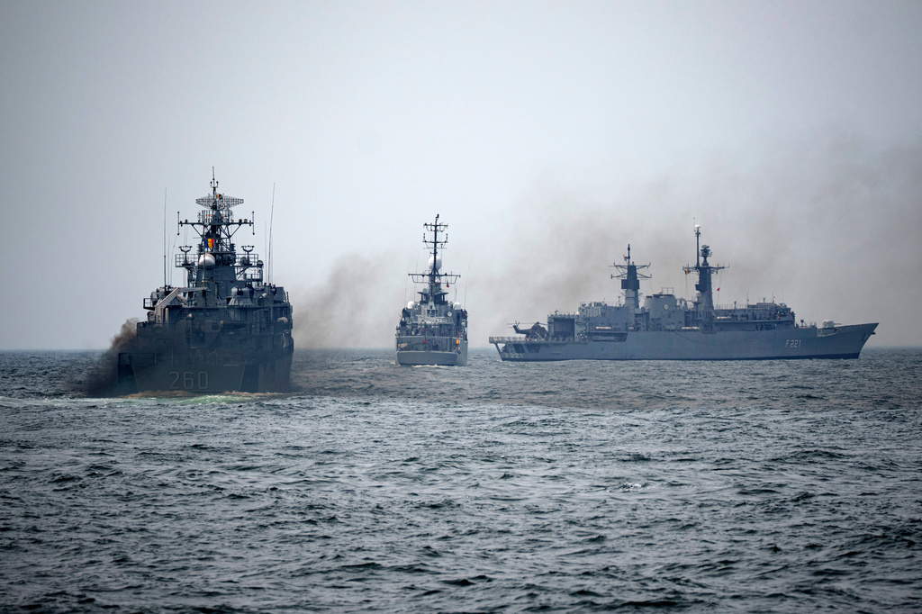 FILE - Romanian warships sail engulfed in smoke during a Romanian Navy led exercise outside Constanta, Romania, on April 16, 2024. (AP Photo/Andreea Alexandru, File)