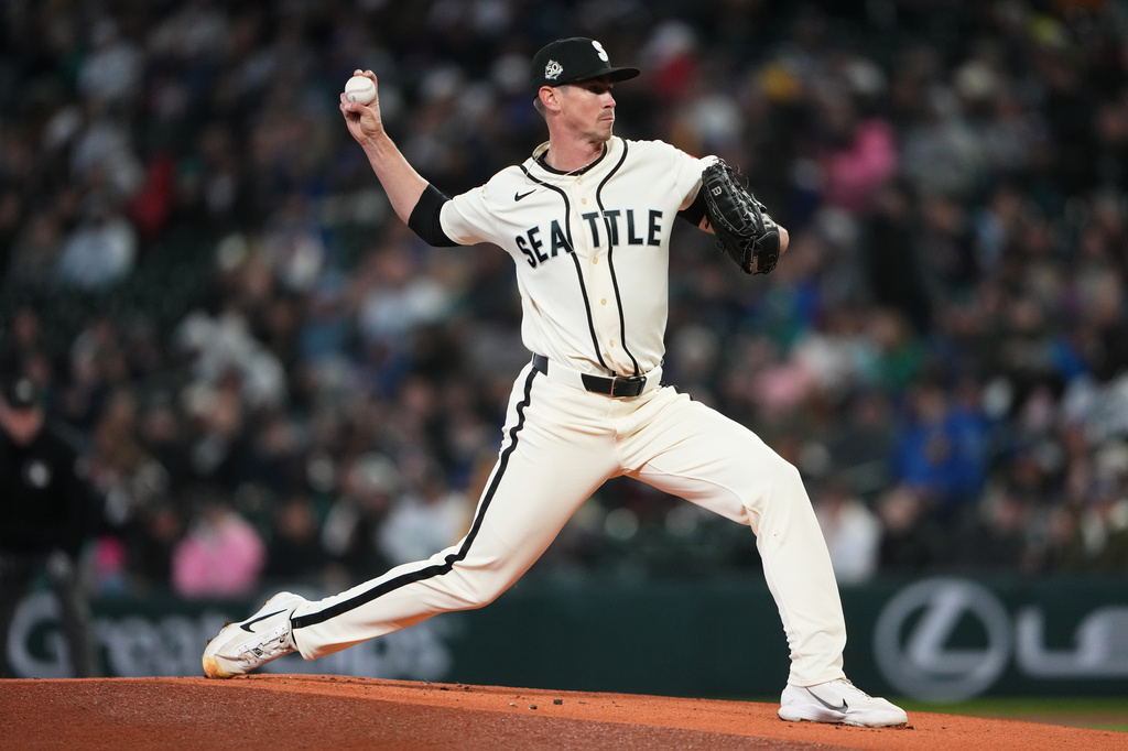 Seattle Mariners starting pitcher Emerson Hancock throws against the Cleveland Guardians during the first inning of a baseball game, Sunday, March 29, 2026, in Seattle. (AP Photo/Lindsey Wasson)