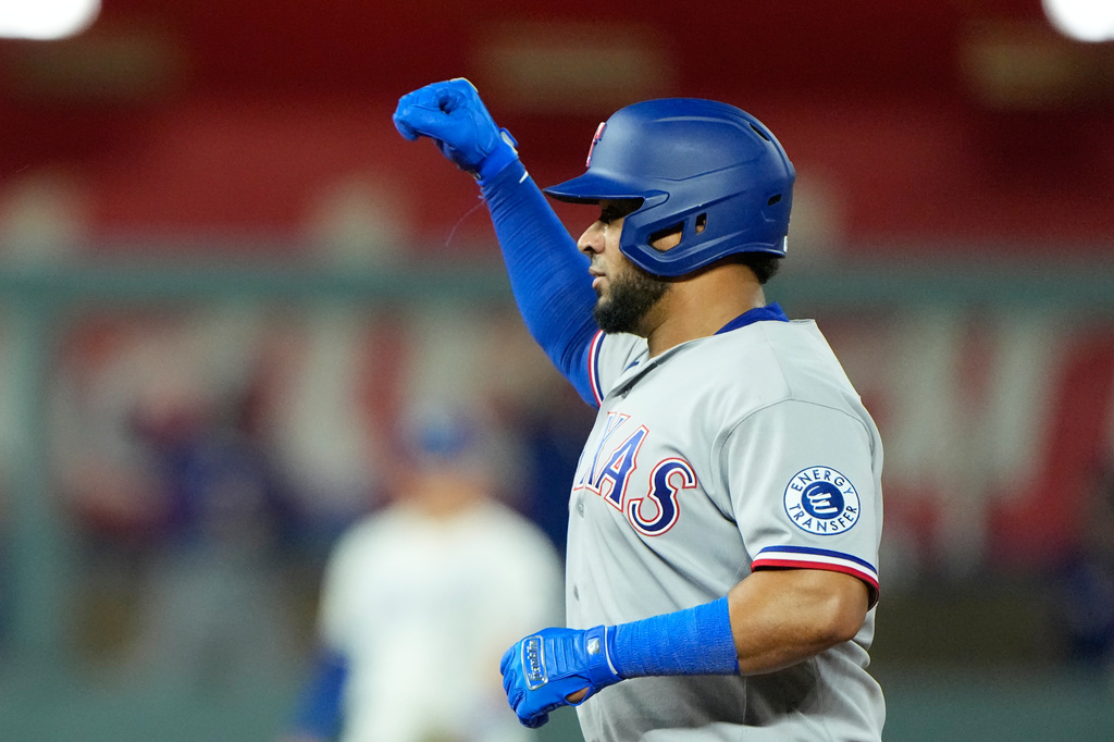 Texas Rangers' Elias Diaz celebrates on second after hitting an RBI double during the 10th inning of a baseball game against the Kansas City Royals, Wednesday, June 10, 2026, in Kansas City, Mo. (AP Photo/Charlie Riedel)
