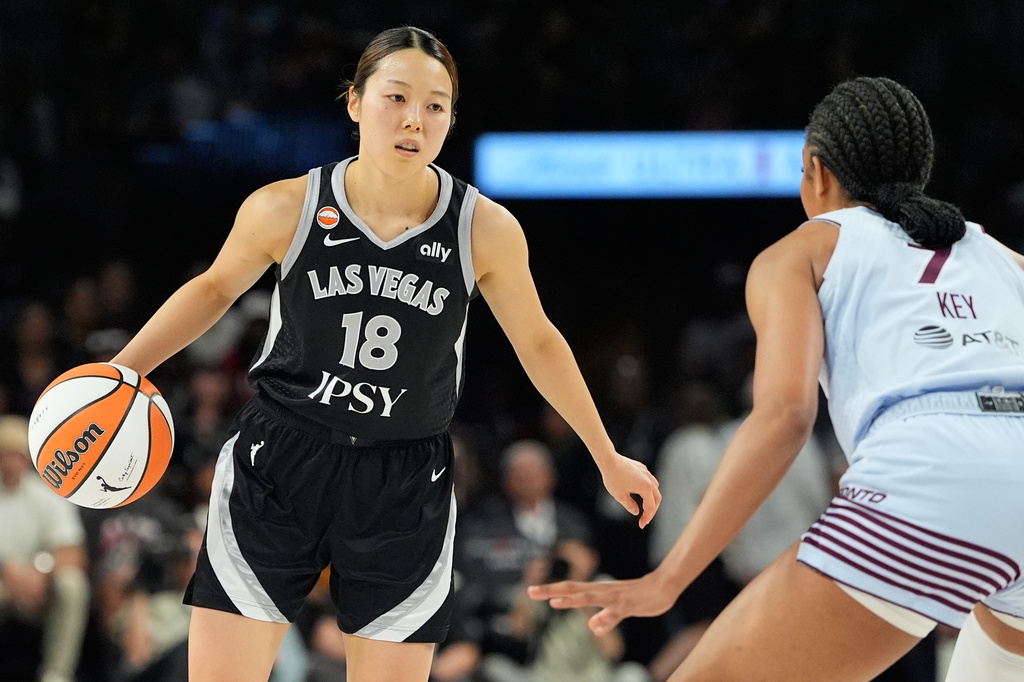 Las Vegas Aces guard Mai Yamamoto (18) drives against Toronto Tempo forward Teonni Key (7) during the second half of a WNBA basketball game Friday, Aug. 28, 2026, in Las Vegas. (AP Photo/John Locher)