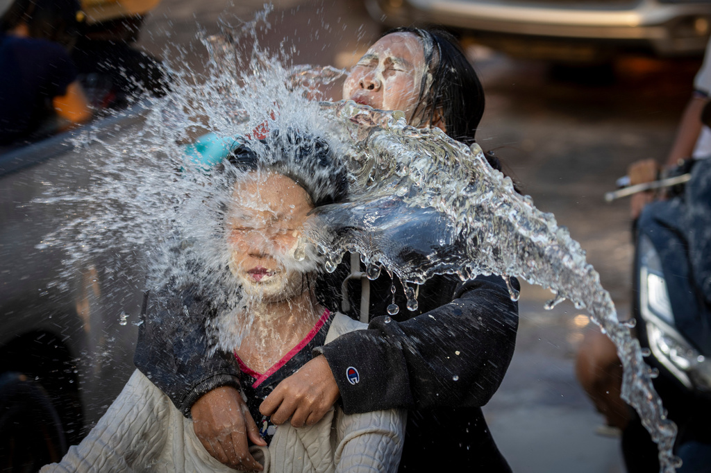 People participate in the Songkran water festival to celebrate the Thai New Year in Prachinburi province, Thailand, Monday, April 13, 2026. (AP Photo/Wason Wanichakorn)