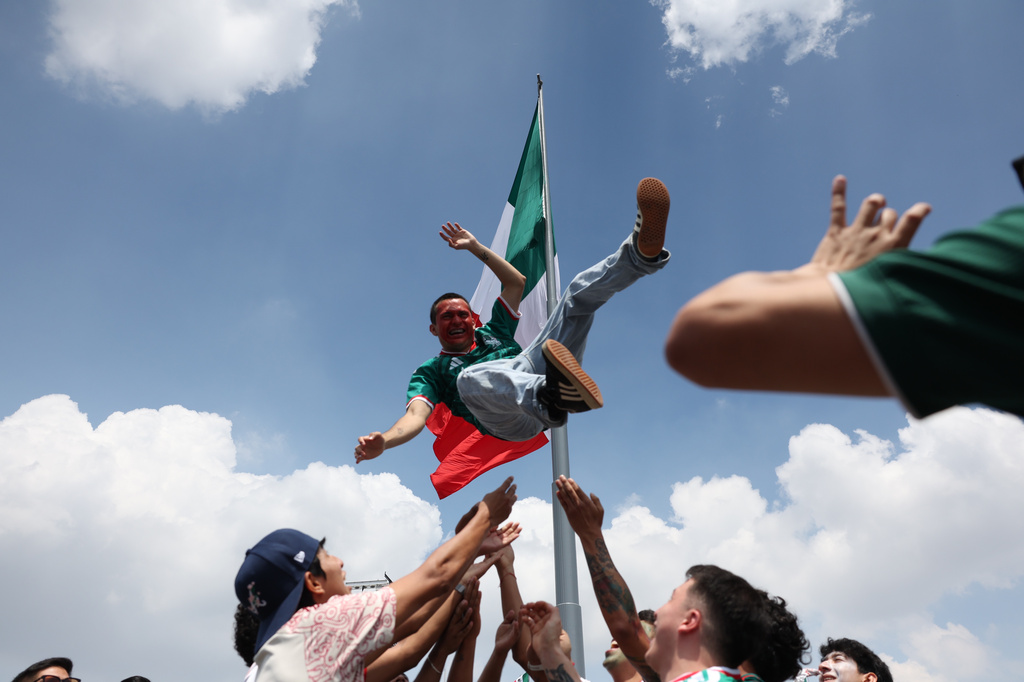 A Mexico fan is tossed into the air in celebration at a fan festival while waiting to watch a broadcast of the World Cup Group A soccer match between Mexico and South Africa in Mexico City, Thursday, June 11, 2026. (AP Photo/Sydney Shankman)