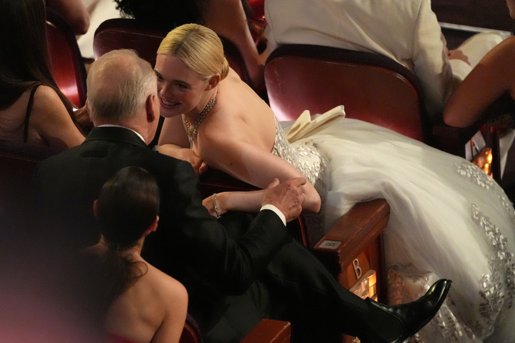 Stellan Skarsgård, left, and Elle Fanning in the audience during the Oscars on Sunday, March 15, 2026, at the Dolby Theatre in Los Angeles. (AP Photo/Chris Pizzello)