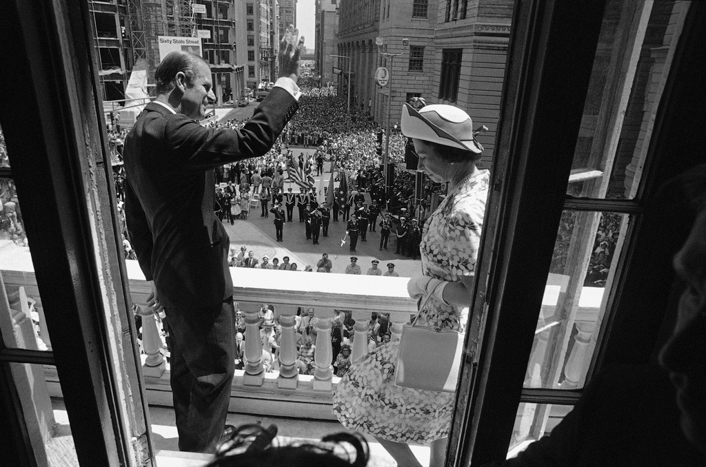 FILE - Queen Elizabeth II and Prince Philip view spectators below from balcony of the Old State House on July 11, 1976 in Boston before the Queen descended to street level to address the crowd. (AP Photo, File)
