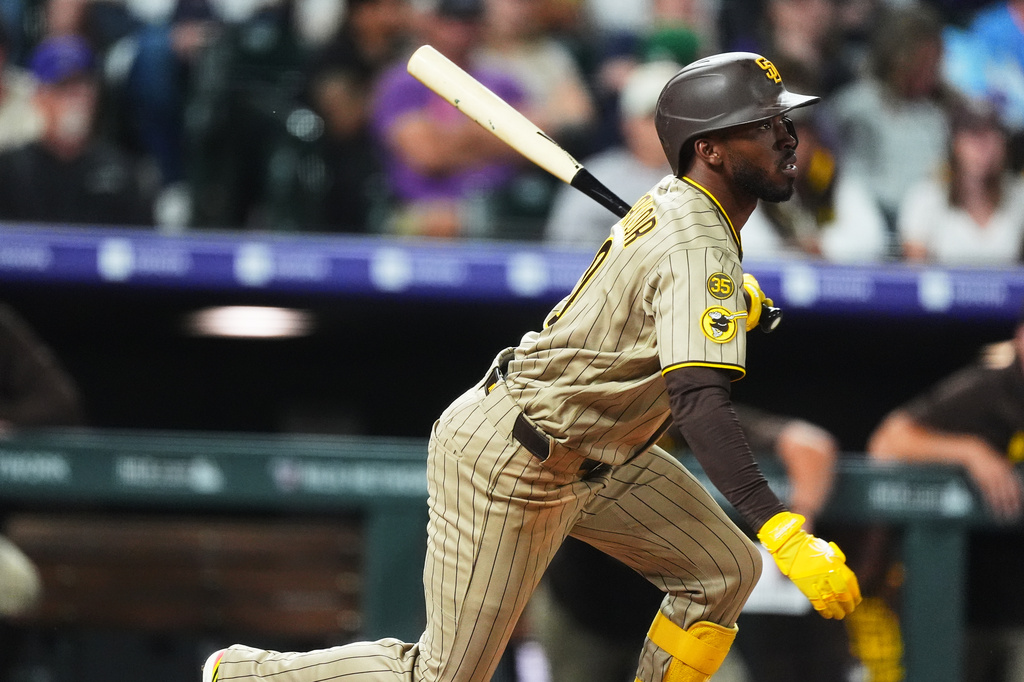 San Diego Padres' Samad Taylor breaks from the batter's box after connecting for a single to drive in two runs off Colorado Rockies relief pitcher Nick Frasso in the fifth inning of a baseball game Wednesday, Sept. 16, 2026, in Denver. (AP Photo/David Zalubowski)
