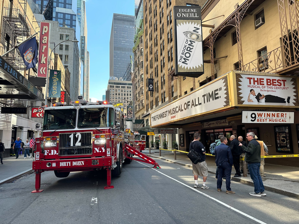 Firetrucks are parked outside of the Eugene O'Neill Theatre in New York on Monday, May 4, 2026. (AP Photo/David Martin)