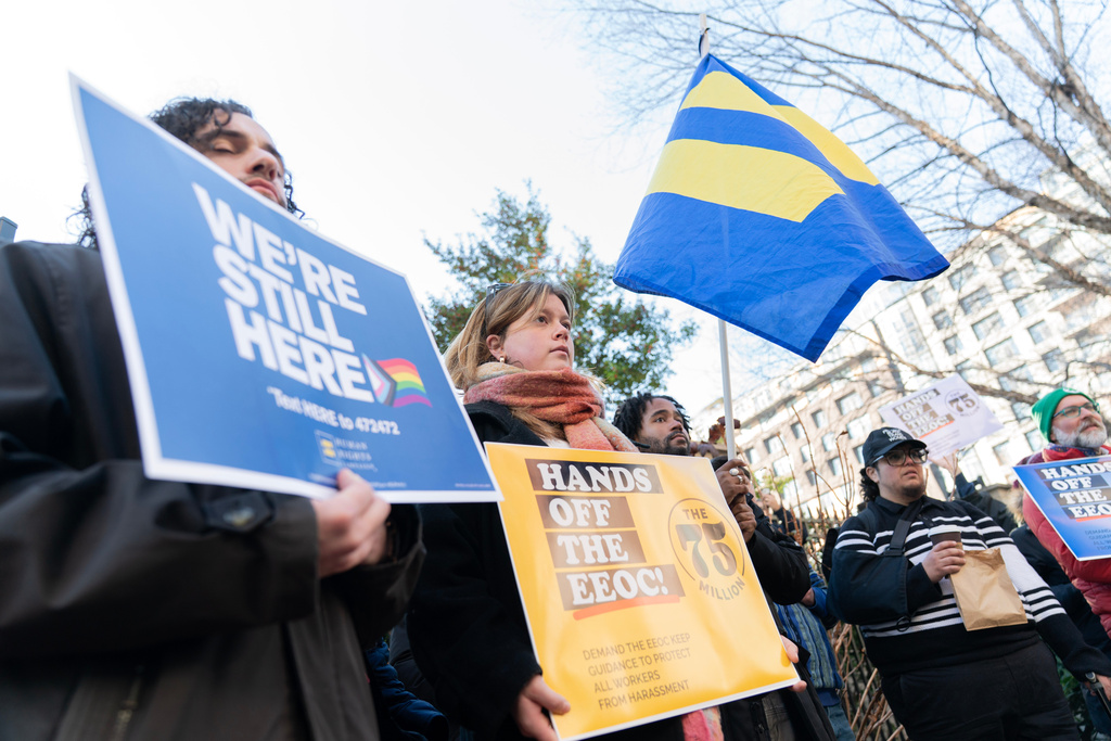Members of the 75 Million coalition rally outside of the Equal Employment Opportunity Commission (EEOC) agency's headquarters Thursday, Jan. 22, 2026, in Washington, opposing the Equal Employment Opportunity Commission's move to rescind its 2024 Enforcement Guidance on Harassment in the Workplace. (AP Photo/Jose Luis Magana)