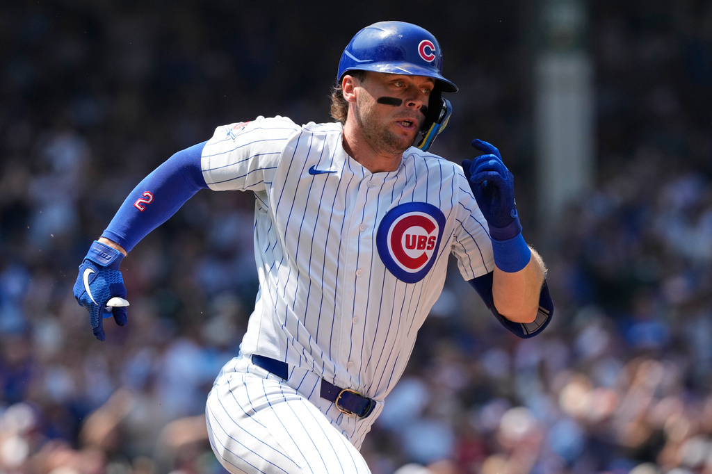 Chicago Cubs' Nico Hoerner runs after hitting a three-run triple during the third inning of a baseball game against the Minnesota Twins in Chicago, Sunday, July 19, 2026. (AP Photo/Nam Y. Huh)