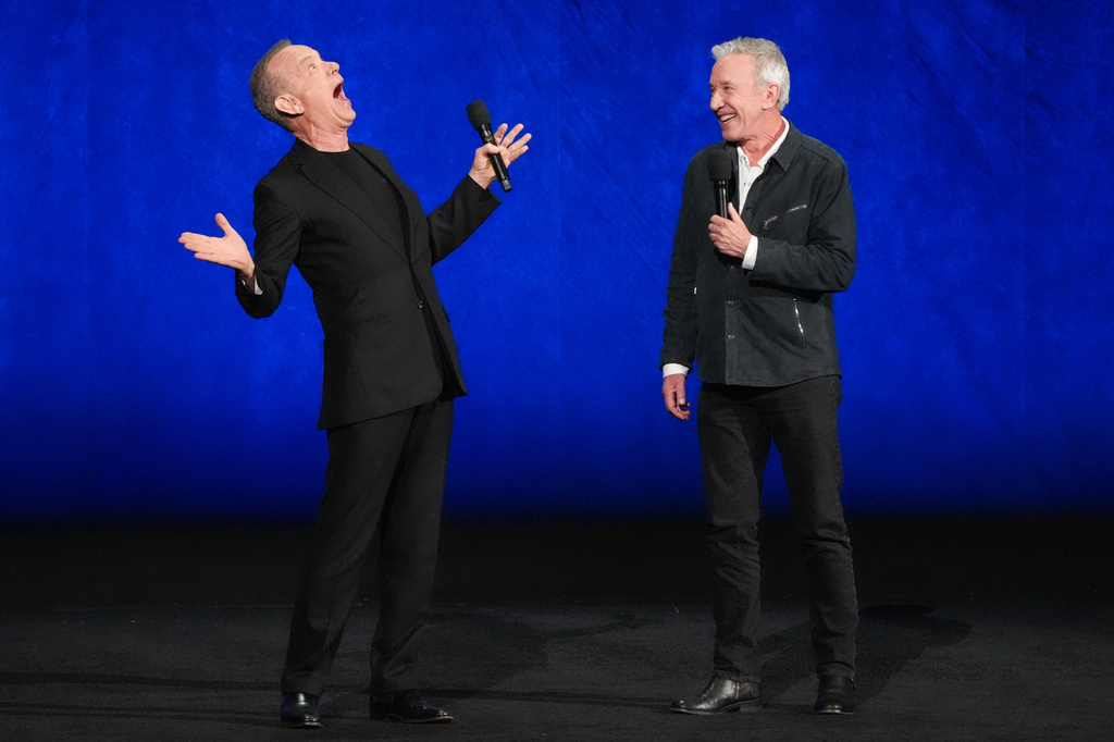Tom Hanks, left, and Tim Allen, cast members of the upcoming film "Toy Story 5," speak during the Walt Disney Studios presentation at CinemaCon on Thursday, April 16, 2026, at Caesars Palace in Las Vegas. (AP Photo/Chris Pizzello)