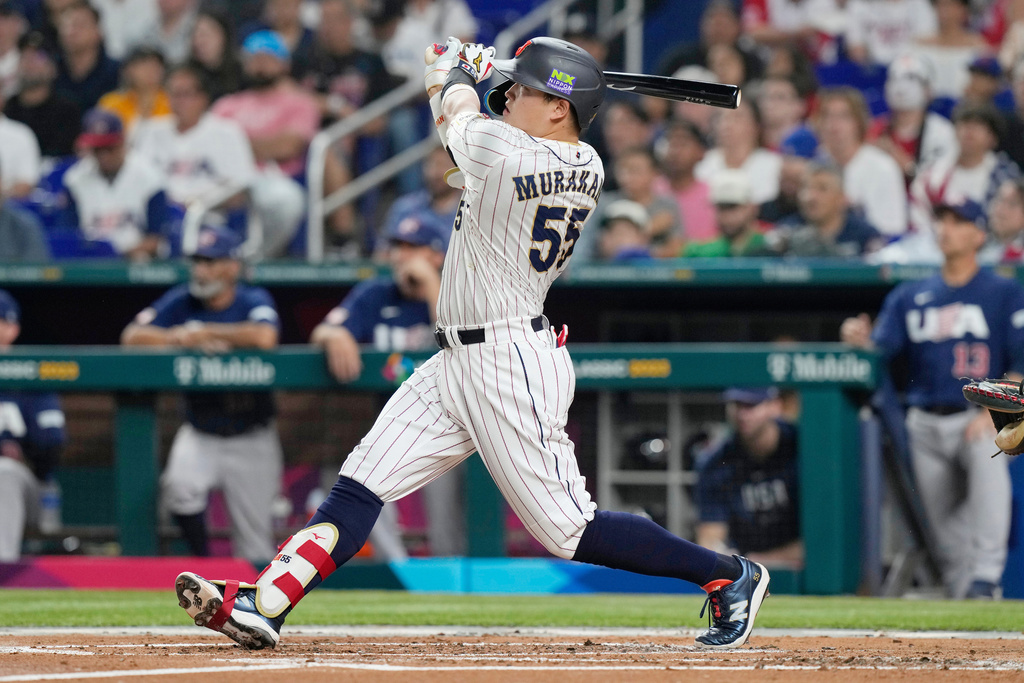 FILE - Japan's Munetaka Murakami (55) hits a home run during the second inning a World Baseball Classic game against the United States, Tuesday, March 21, 2023, in Miami. (AP Photo/Marta Lavandier, File)