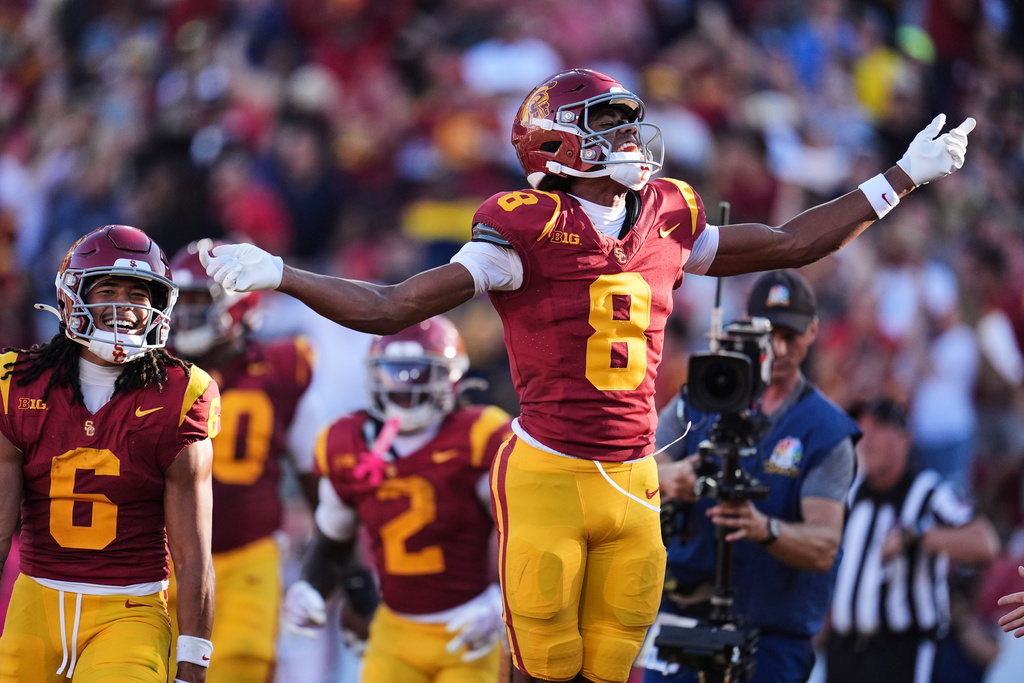 Southern California wide receiver Ja'Kobi Lane (8) celebrates after catching a touchdown during the first half of an NCAA college football game against Michigan, Saturday, Oct. 11, 2025, in Los Angeles. (AP Photo/Marcio Jose Sanchez)