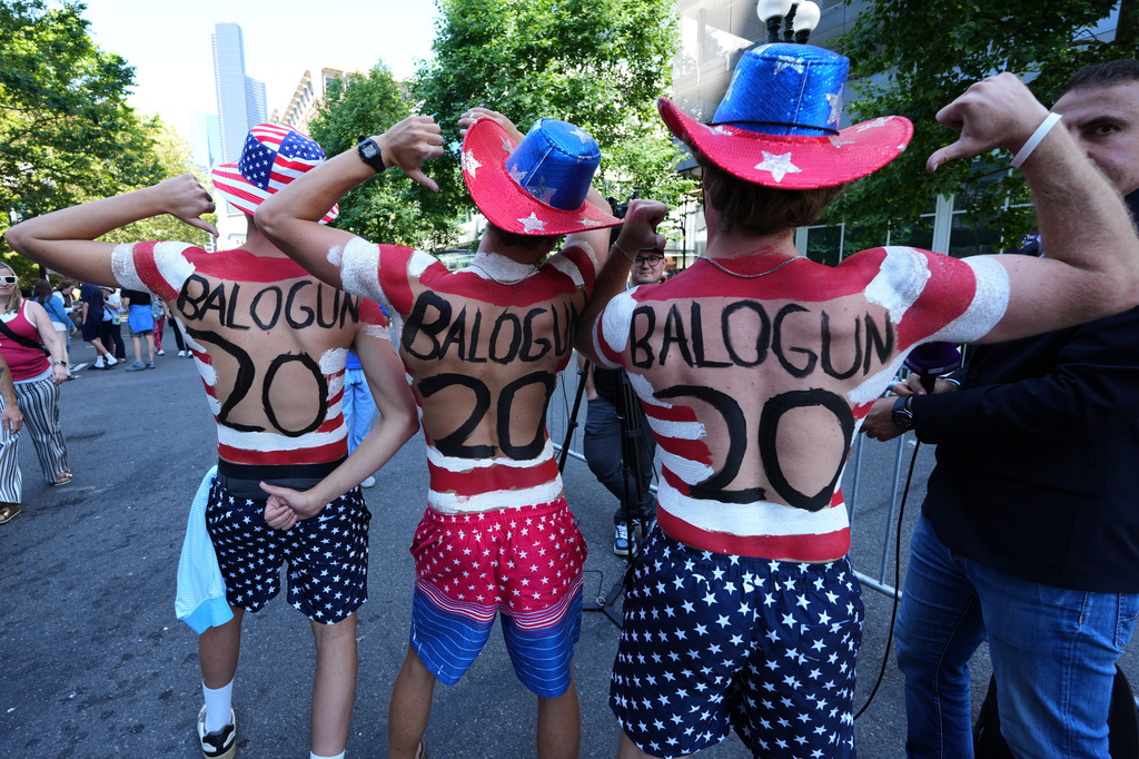 United States fans show their support for Folarin Balogun as they parade near the stadium before the World Cup round of 16 soccer match against Belgium in Seattle, Monday, July 6, 2026. (AP Photo/Ted S. Warren)