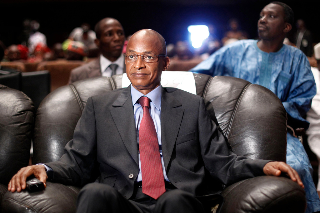 FILE - Cellou Dalein Diallo sits at the People's Hall in Conakry, Guinea, Sept 21, 2010. (AP Photo/Jerome Delay, file)